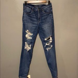 COPY - Distressed  mid rise blue jeans